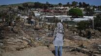 Rahima stands in Moria camp following the fires